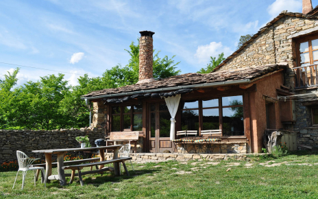 Front of the property gardens with rustic table